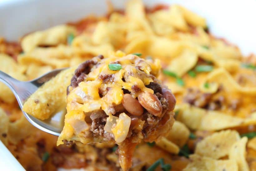 Looking for a simple easy weeknight dinner that the entire family can enjoy? You'll want to grab a bag of Fritos and try this easy and delicious Walking Taco Casserole!