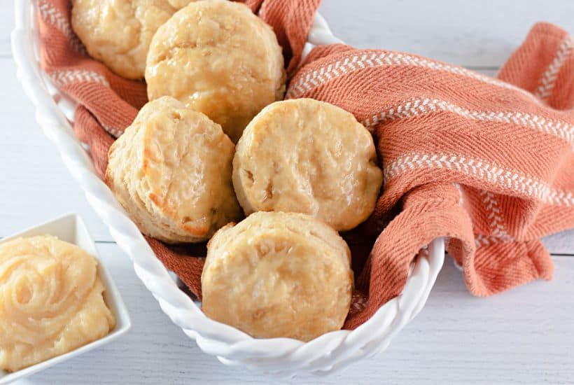 When craving light and fluffy biscuits, give this Honey Butter Biscuits recipe a try. They have the perfect taste and texture, pairing perfectly with all kinds of flavorful meals. These soft and flaky buttermilk biscuits are brushed with homemade honey butter.