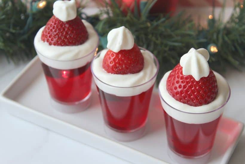 Bring in the celebration during the holiday season with these Santa Hat Jello Shots. This fun Christmas Jello Shot recipe tastes absolutely amazing! This easy jello shot recipe is a perfect holiday party recipe idea.