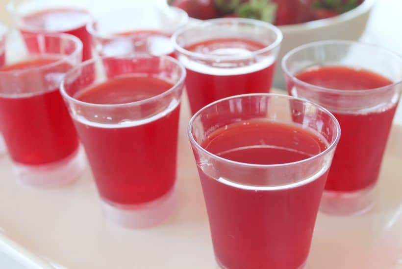 Bring in the celebration during the holiday season with these Santa Hat Jello Shots. This fun Christmas Jello Shot recipe tastes absolutely amazing! This easy jello shot recipe is a perfect holiday party recipe idea.