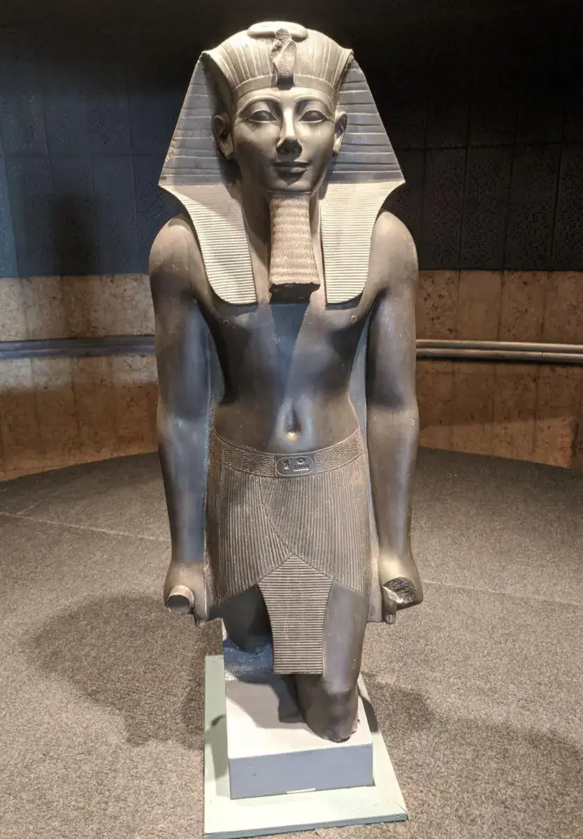 Statue of Pharaoh Thutmose III displayed inside Luxor Museum
