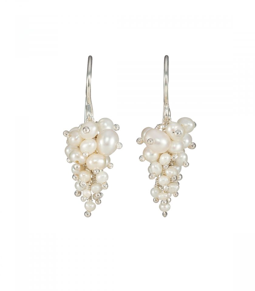 A pair of pearl and silver cluster earrings
