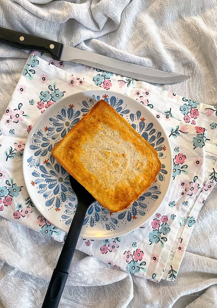 toastie on plate with spatula.