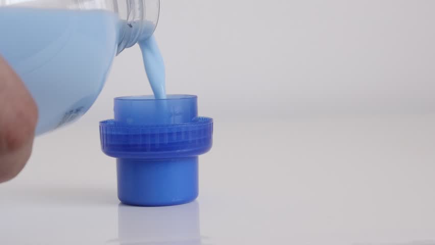 Measuring fabric softener in the cap