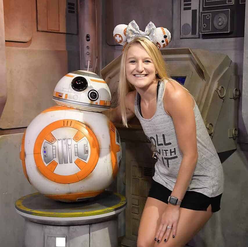 BB-8 Star Wars droid with smiling woman at 407 and Beyond Vacation Co.
