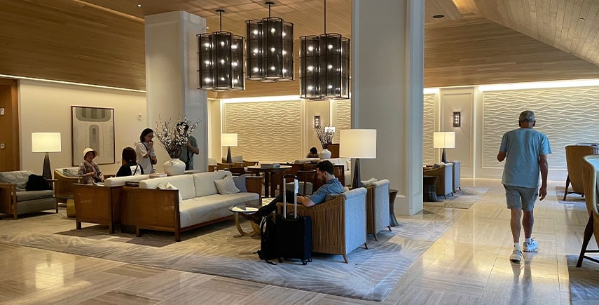 Elegant hotel lobby with clean seating and shiny floors, meeting hygiene expectations for guests.
