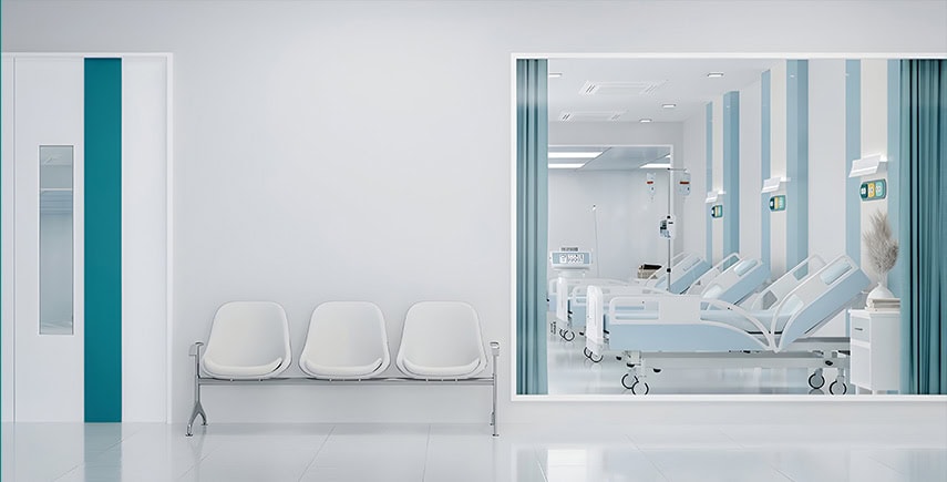 Clean hospital ward with beds and waiting area, promoting green healthcare through hygiene and sustainability.