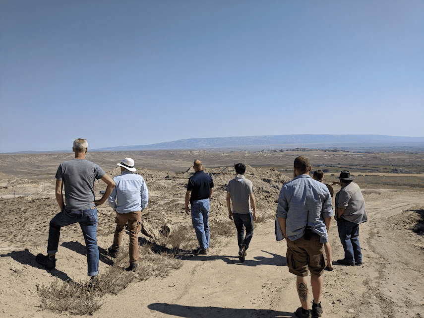 An image of a group of people examining a site for video production