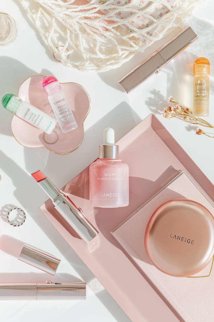 skincare and makeup products in elegant flat lay