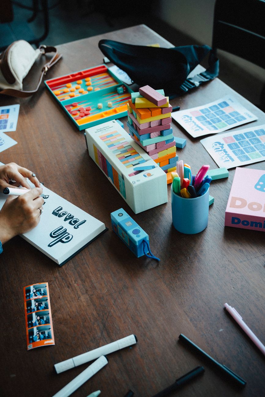 creative workspace with games and stationery