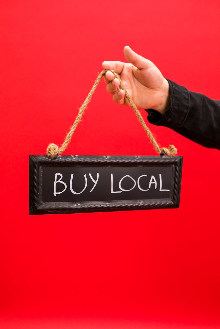 a buy local signage. A closer look at how the TV show The Neighborhood tackles gentrification and shopping local—and where the reality of online sales and small business survival is more complex.