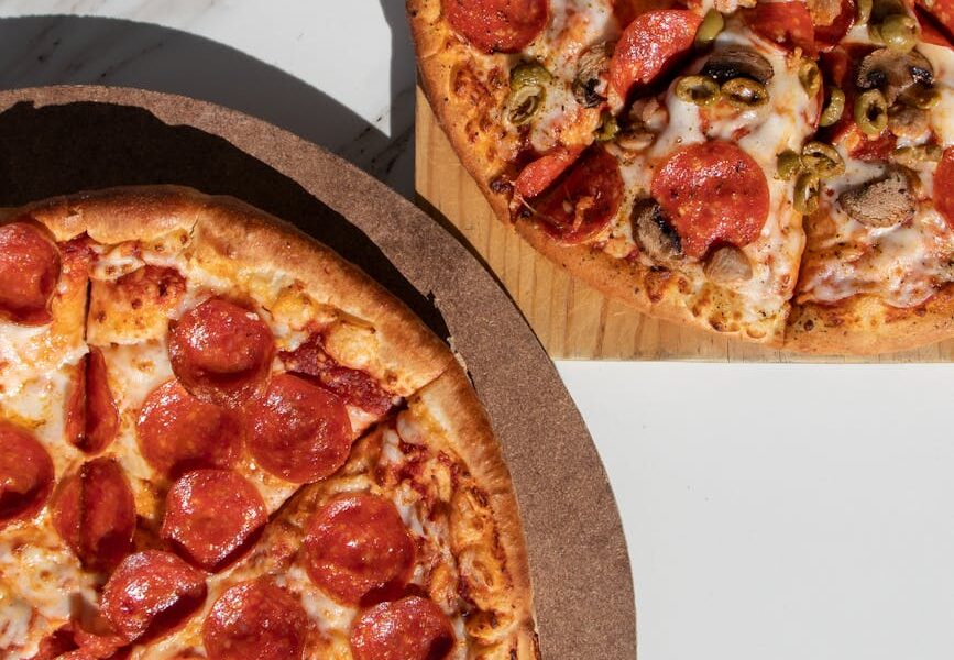 pizza on brown wooden tray