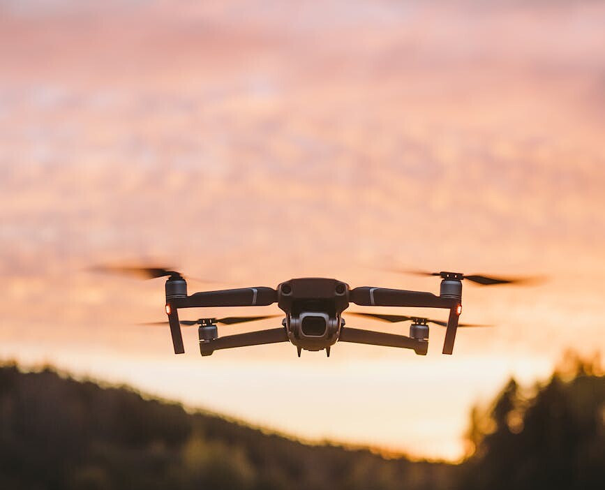 selective focus photo of flying drone