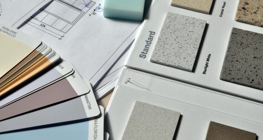 Guelph basement renovation material samples and color palette on a blueprint.