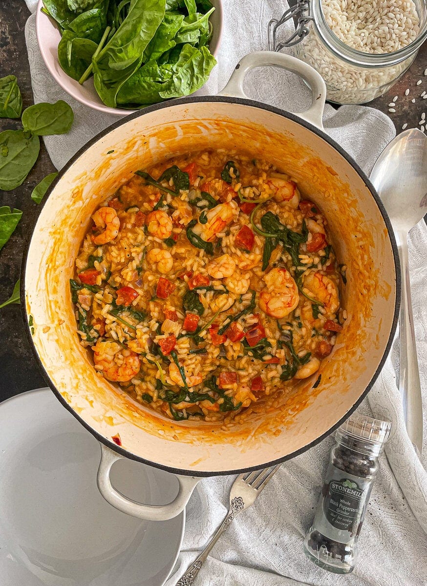 close up of risotto in cast iron cooking dish.