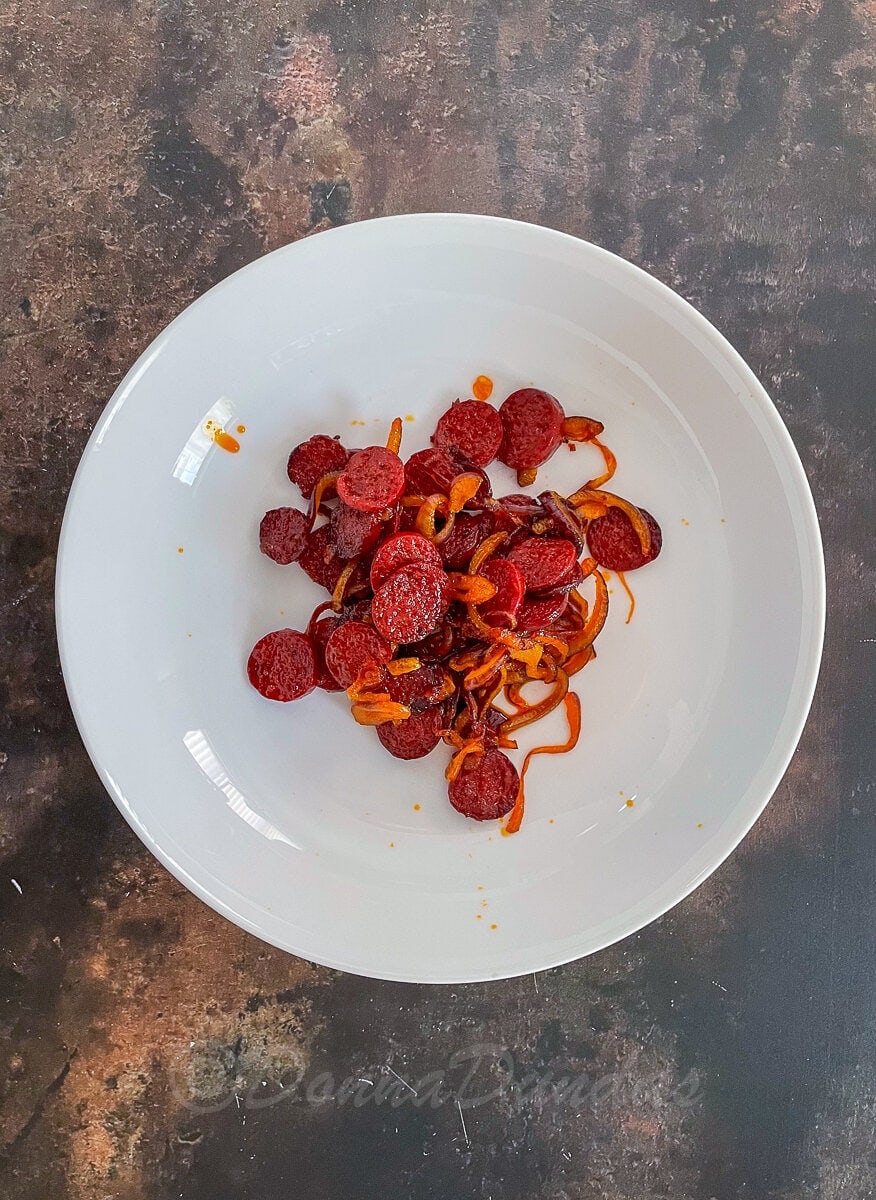 fried chorizo and onion in bowl.