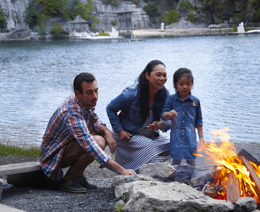 Family of Three Near a Campfire Next to Lake Mohonk