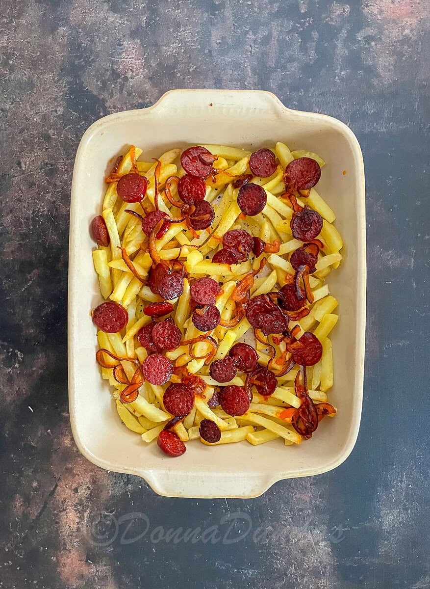 fries and chorizo in cooking dish.