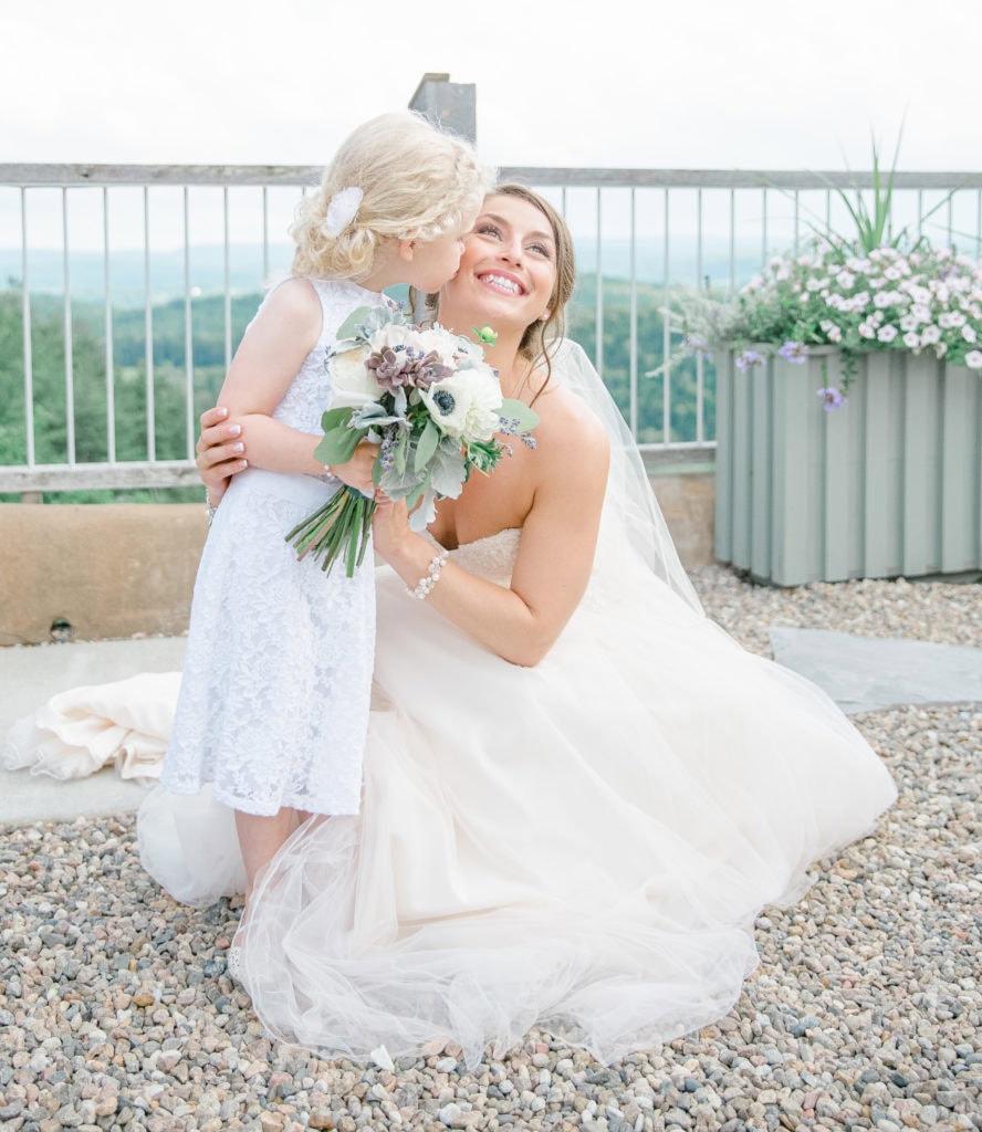 Flower Girl Kissing Bride on her Wedding Day - Lavender Rain Inspired Wedding - Le Belvedere- Grey Loft Studio- Ottawa Wedding Photographer - Affordable - Cheap - Fine Art - Best - Kanata Photographer - Wedding Videographer Ottawa - Light and Airy - Beautiful - Timeless - Organic Photographer Carp - Stittsville