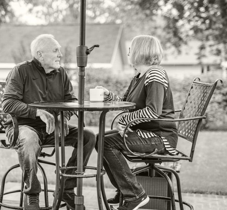 retired couple having coffee