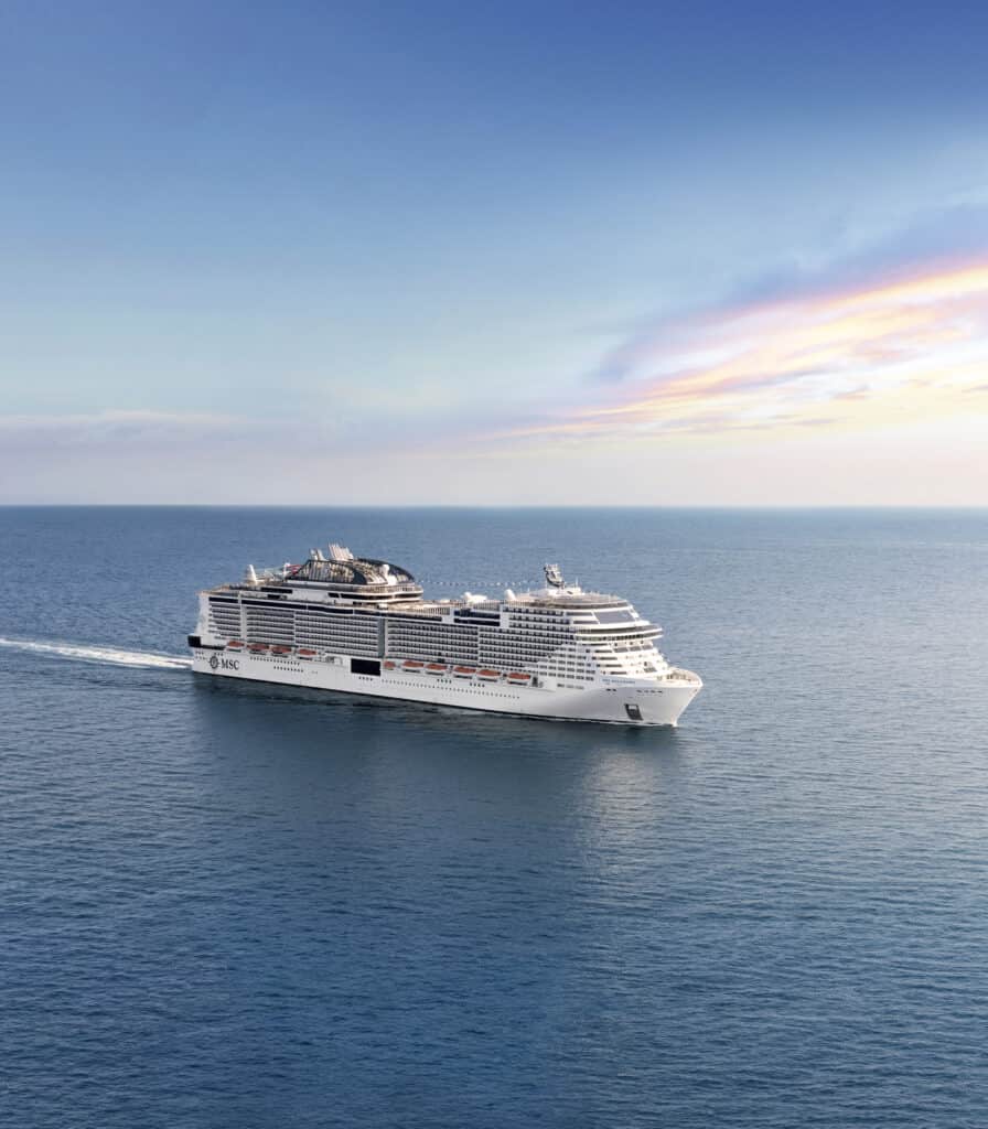 Luxury cruise ship sailing in open ocean with vibrant sunset sky, offering luxury vacation experiences.
