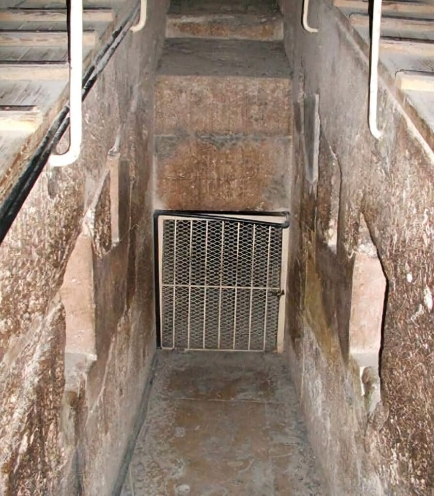 Archaeologists exploring a newly discovered passageway inside the Great Pyramid of Giza, uncovering hidden chambers.