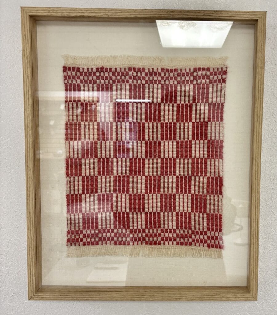 Frame with red and cream checkered textile