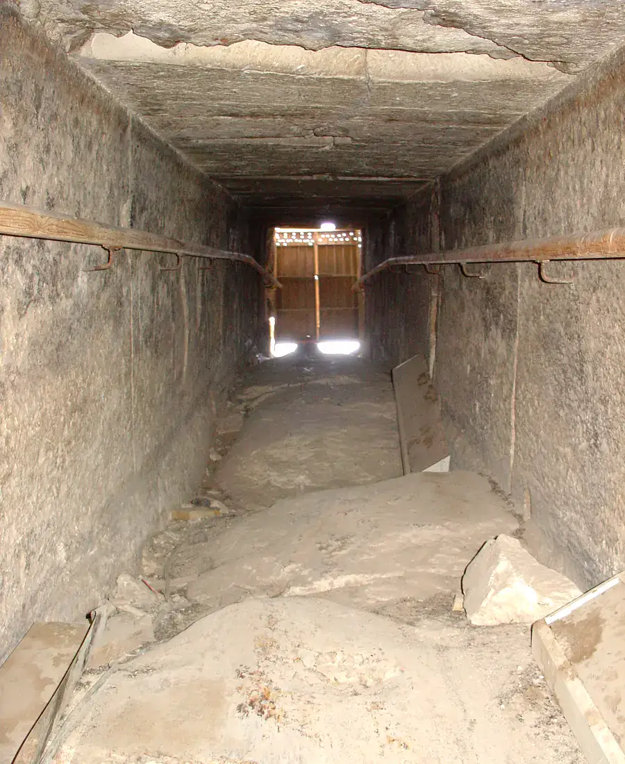 Damaged corner exposing core masonry beneath limestone casing