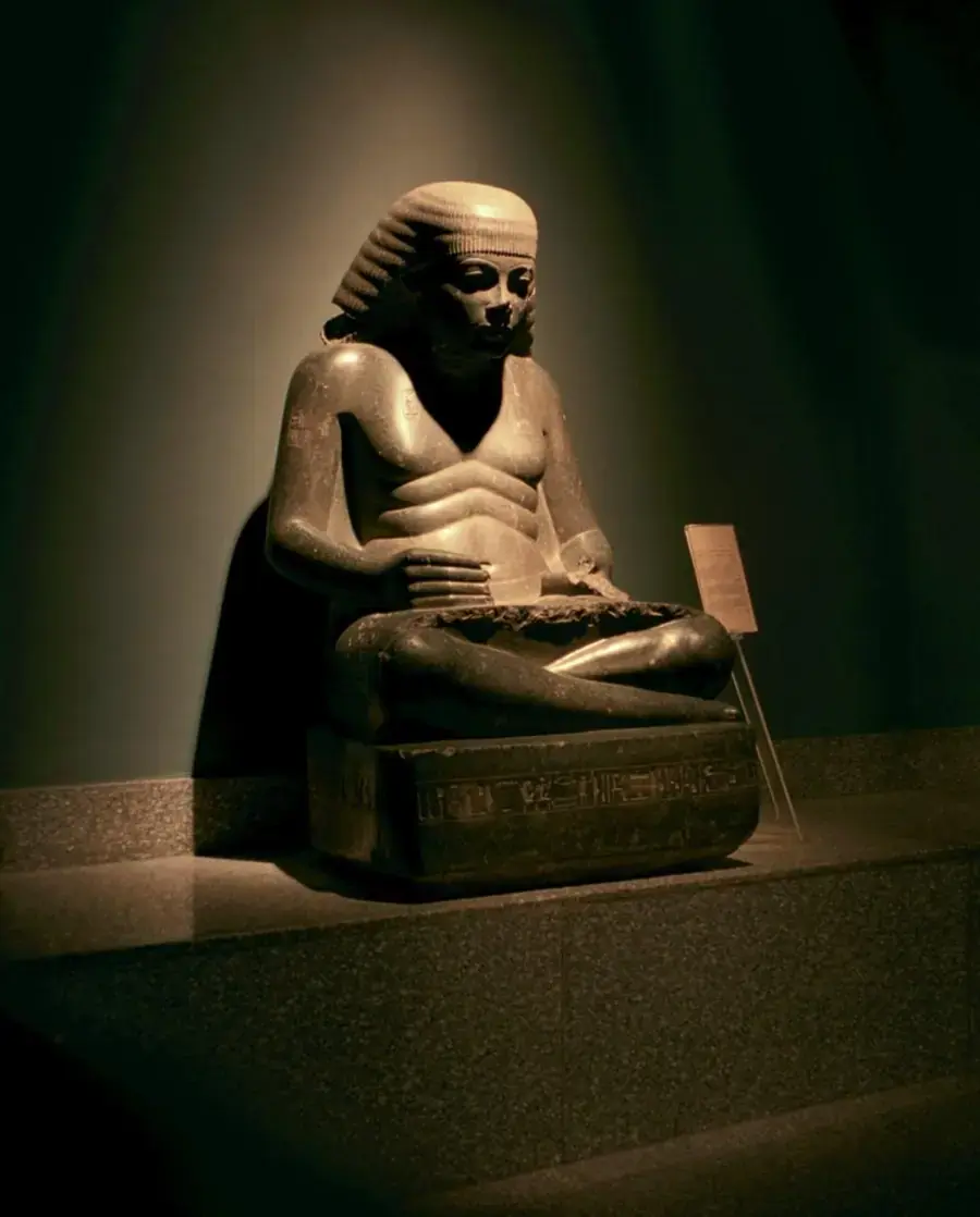 Ancient Egyptian official seated with a writing surface
