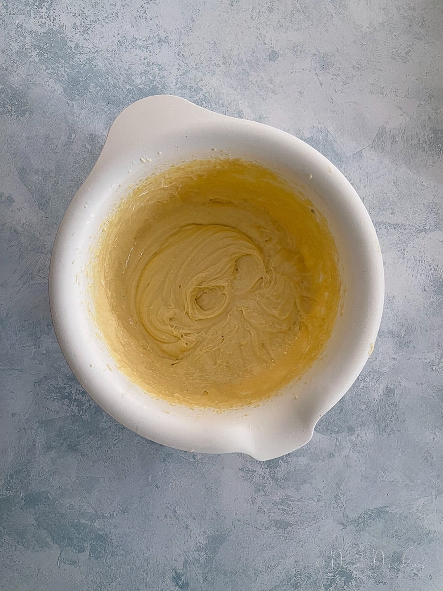 cake batter in white mixing bowl.