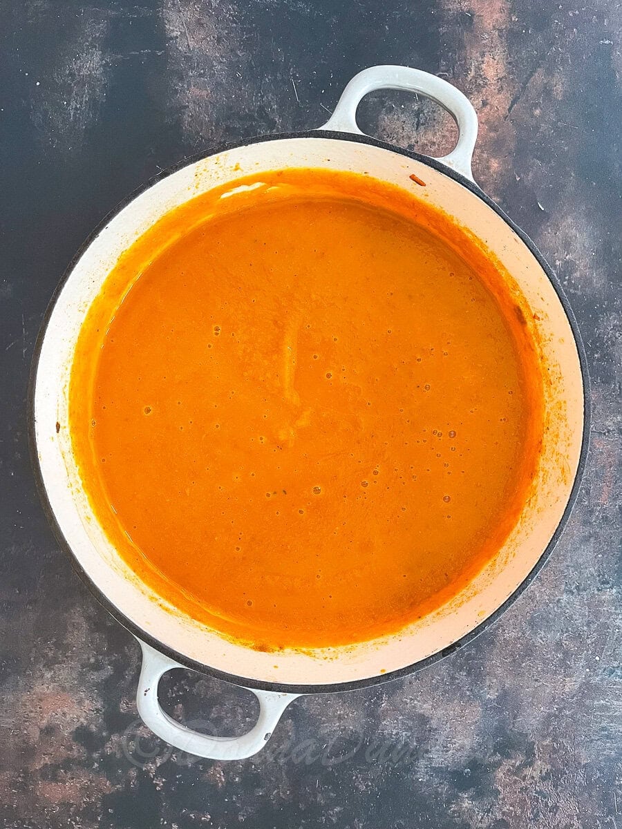 blended sweet potato and chorizo soup in Dutch Oven.