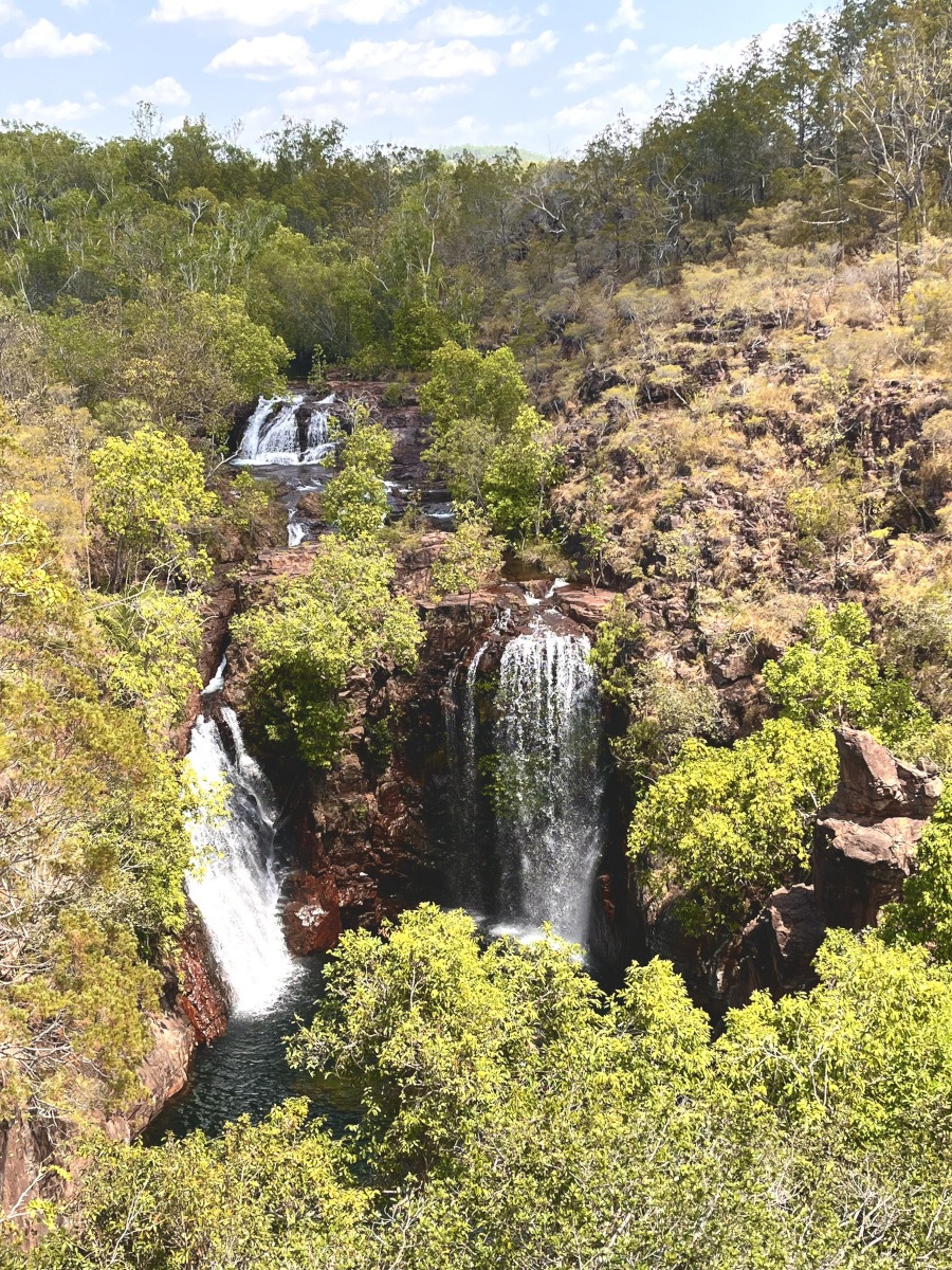 View of twin waterfalls from above in Litchfield National Park, surrounded by lush vegetation