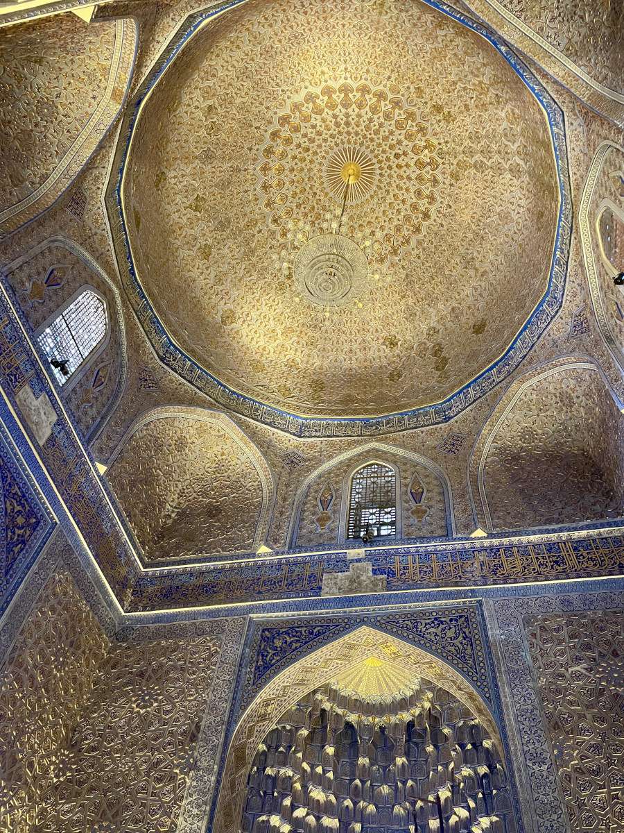 Ornate golden interior and ceiling inside mausoleum in samarkand