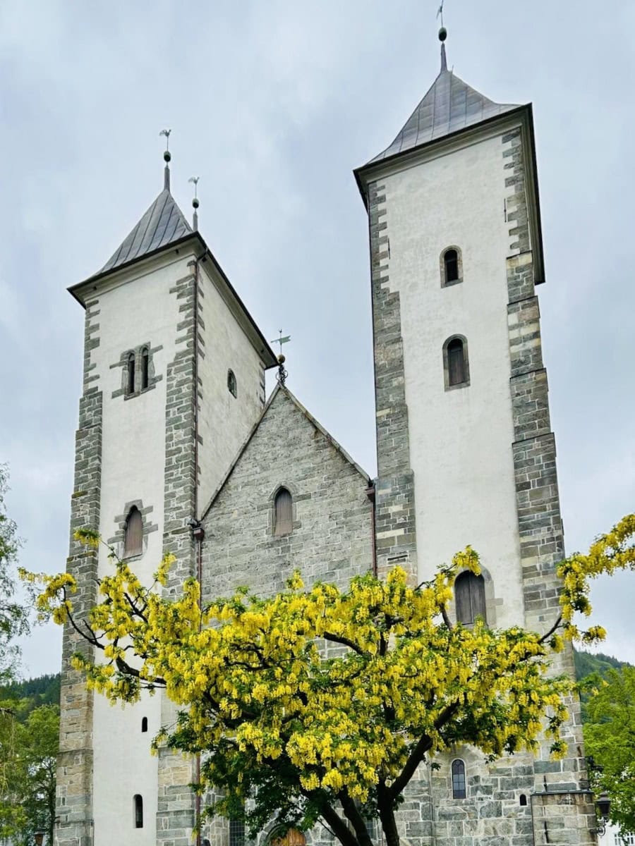st_mary_church_bergen View of of St. Mary's Church with a blooming tree in front