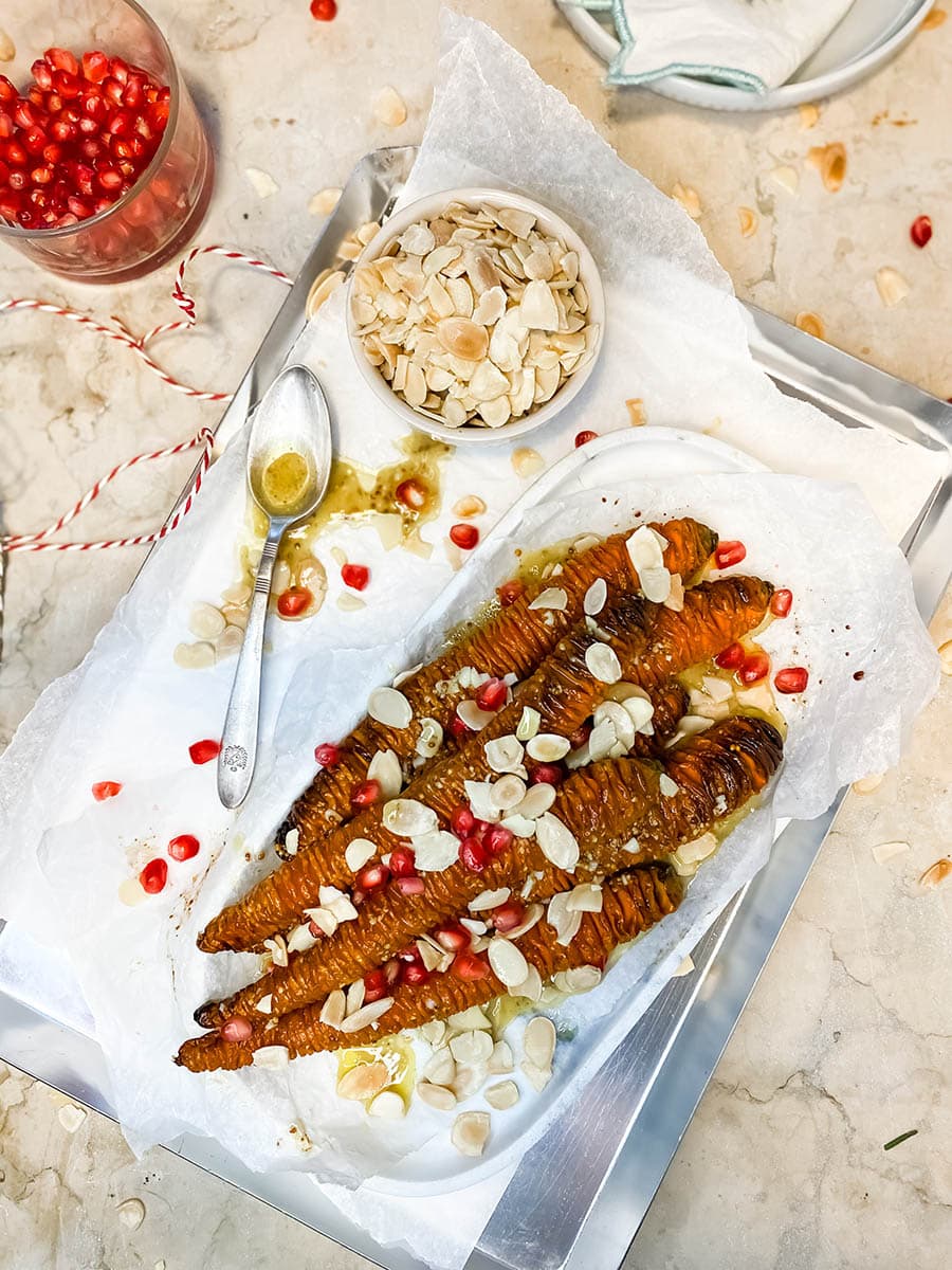 Deliciously Healthy Hassleback Carrots With Almond And Pomegranate