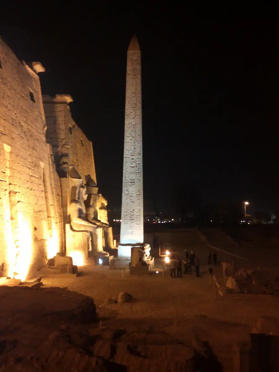 Luxor Temple obelisk illuminated at night
