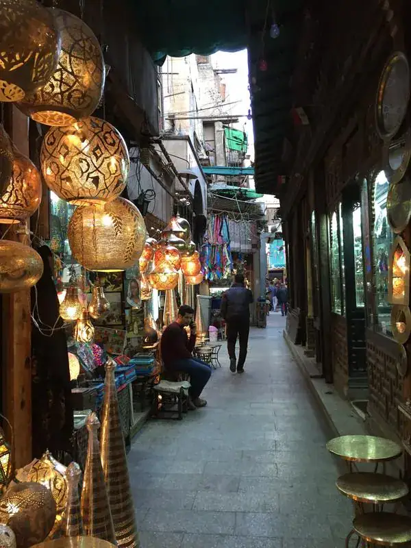 Traditional lanterns in a narrow Cairo bazaar street