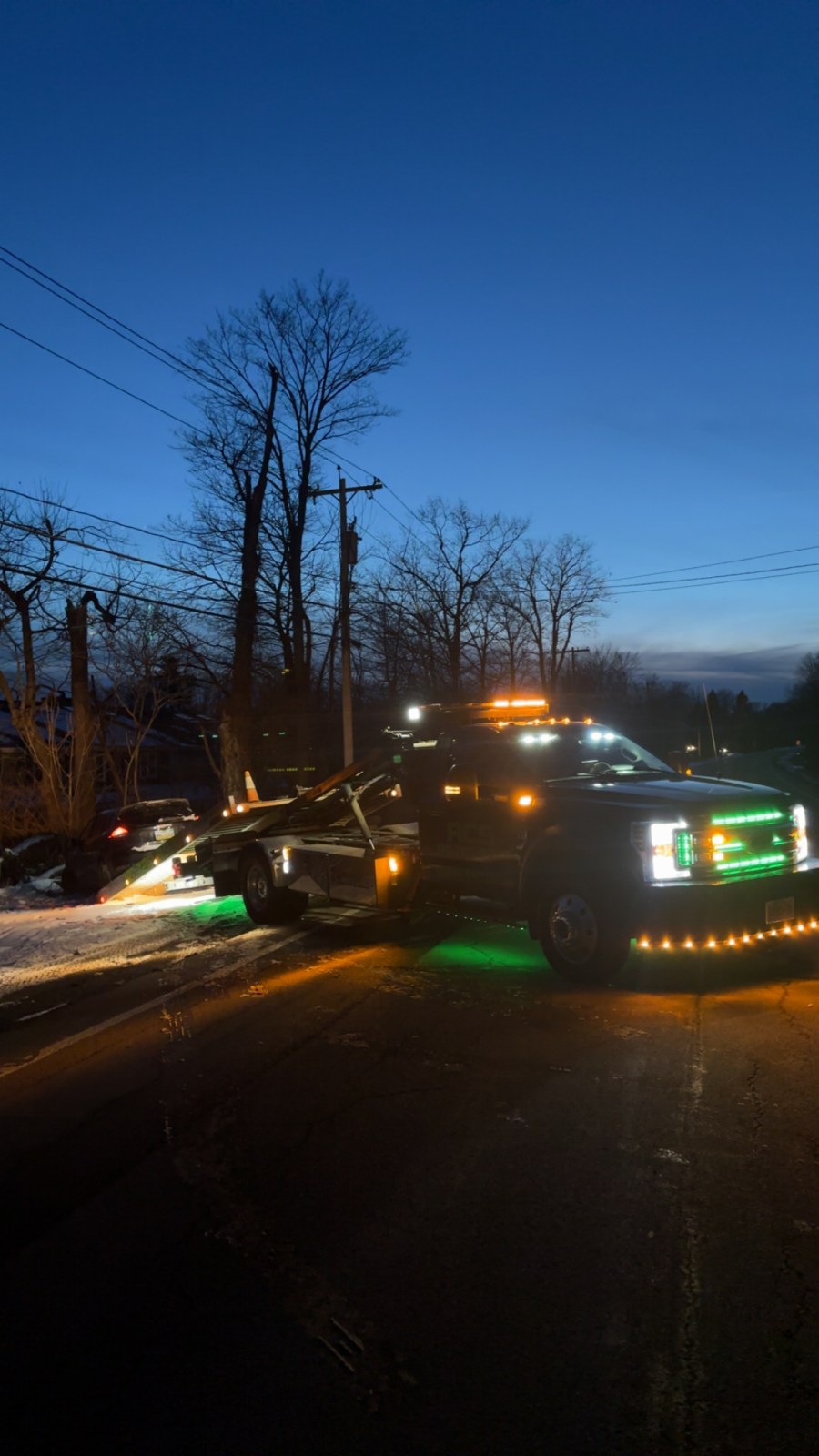 RCS tow truck lit up on a night call