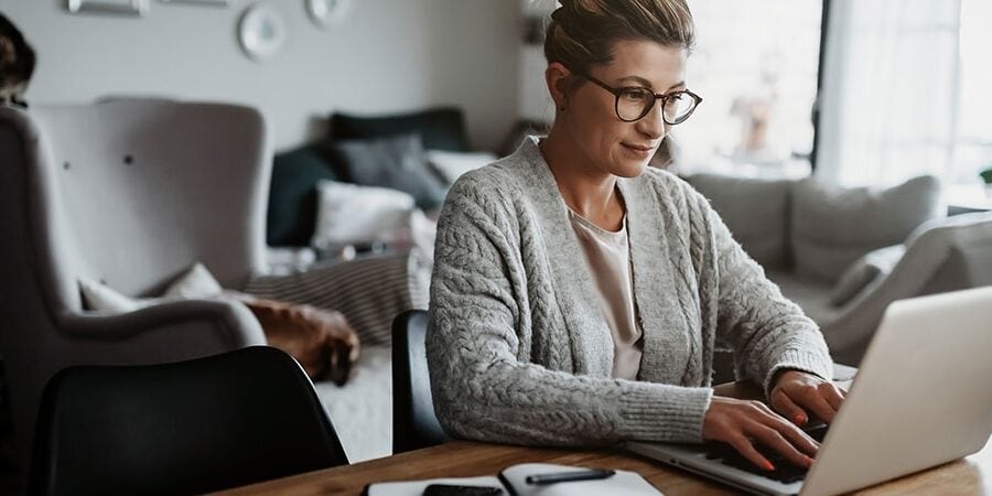 a lady reading about How To Do Online Banking