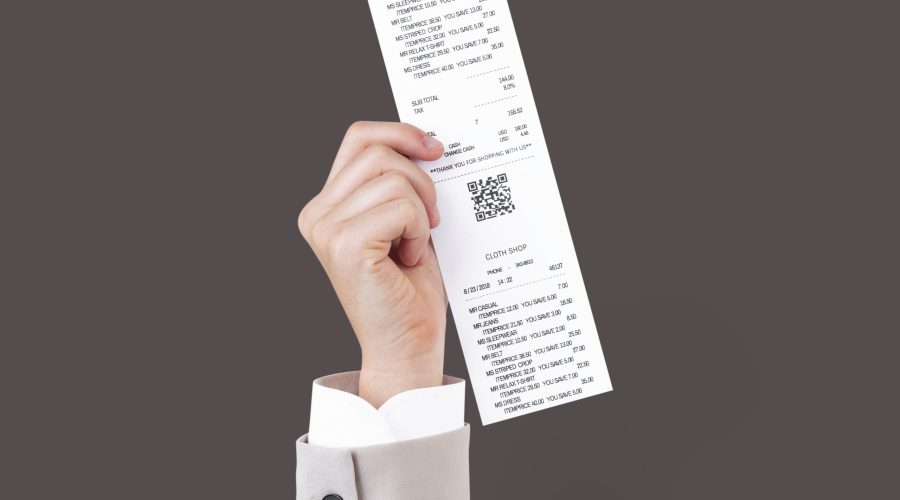 Hand holding receipt for shopping campaign