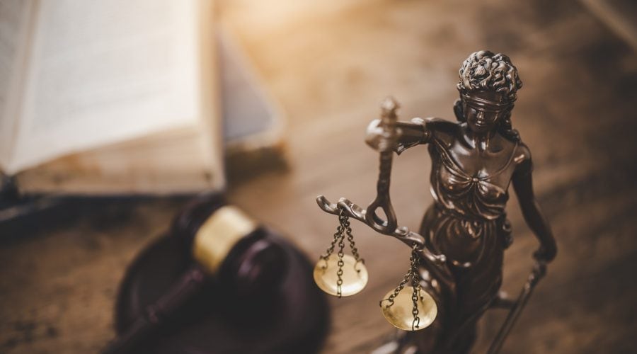Law theme, mallet of the judge, law enforcement officers, evidence-based cases and documents taken into account