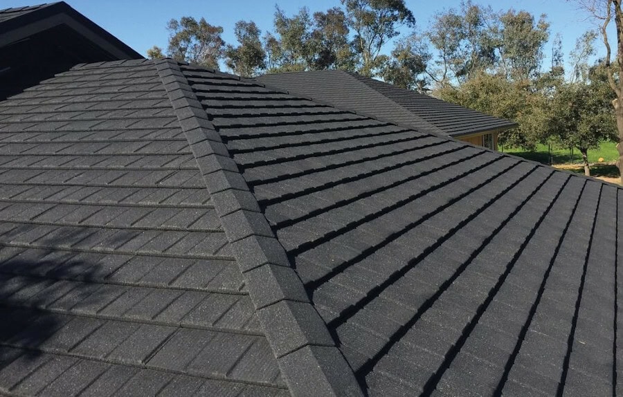 Close up of dark grey color stone coated steel roof.