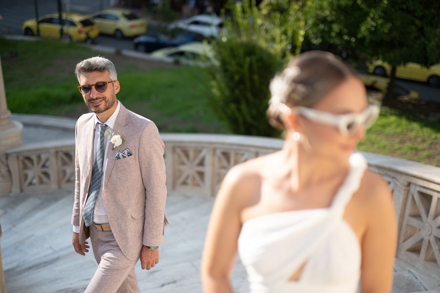 Stylish bride and groom in Athens architecture