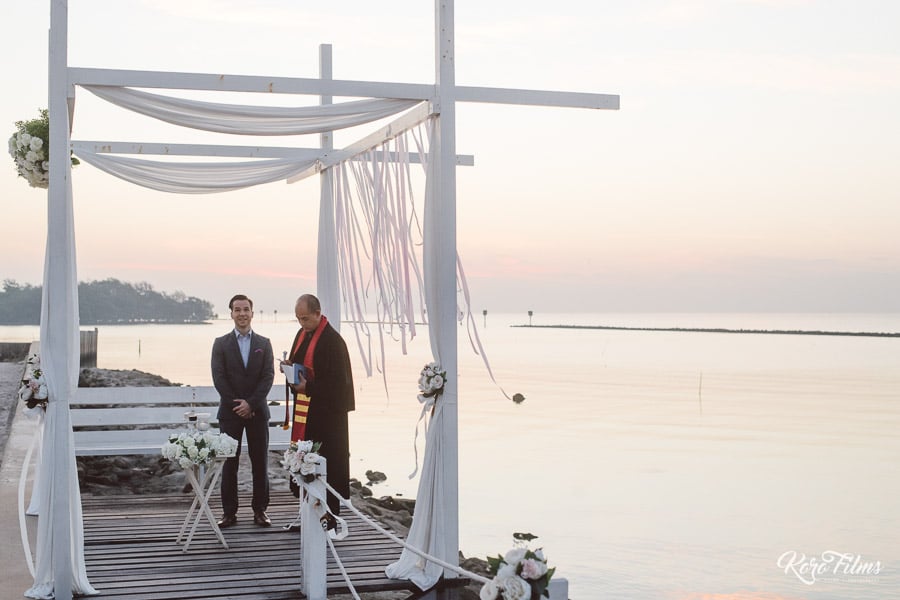 Western Wedding groom and priest wait for bride at Bang Pu Recreation Centre