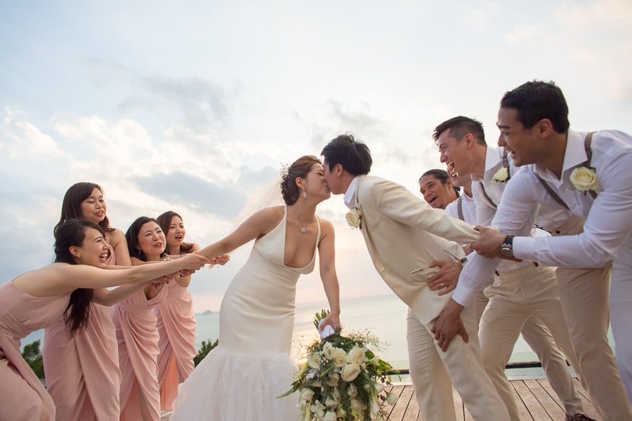 Western Wedding Kiss among friends At sea