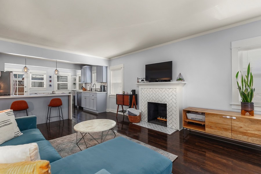 2632 Madison Avenue - Living Room Area with Wood Floors and a Fireplace