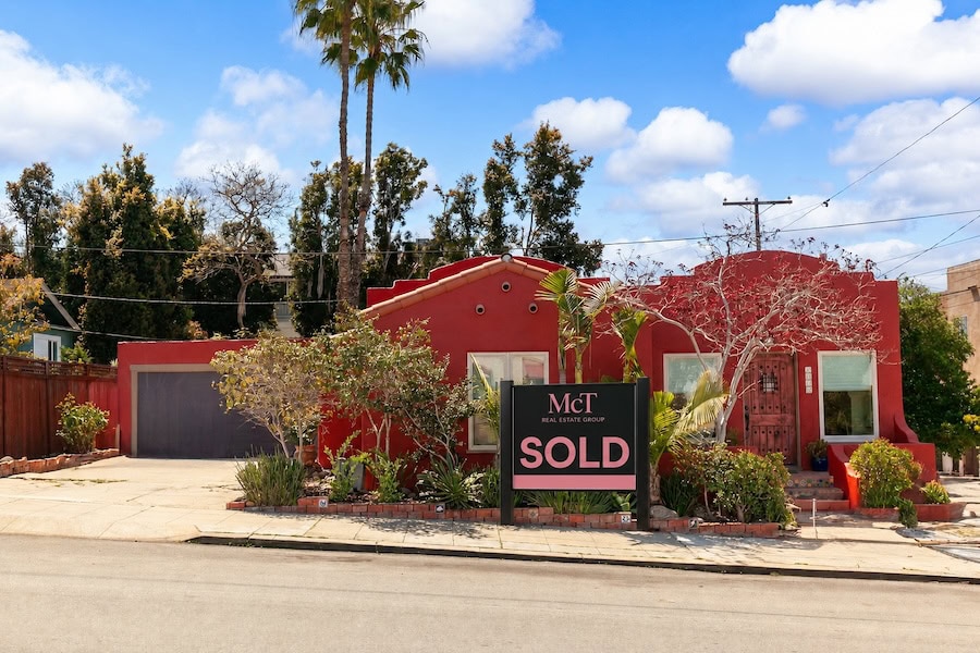McT Real Estate Group SOLD sign in front of a red Spanish-style home in North Park San Diego