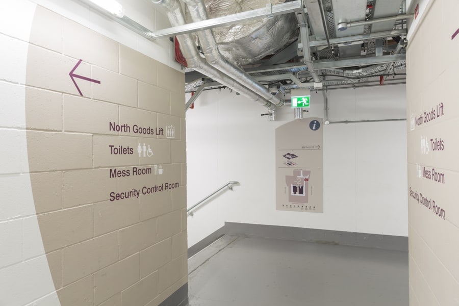 Basement plan sign accompanied by large scale graphics providing directional information