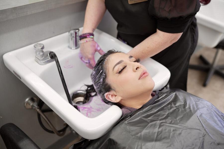 woman at hair salon getting hair washed