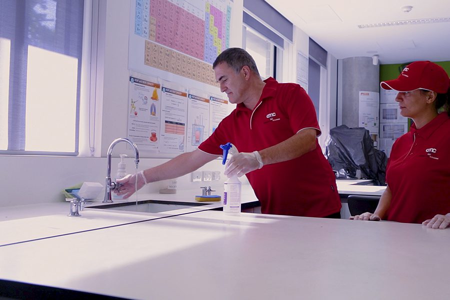 AMC Commercial school cleaning training to sanitise science laboratory 